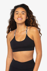 Y Strap Signature Sports Bra close up smiling model